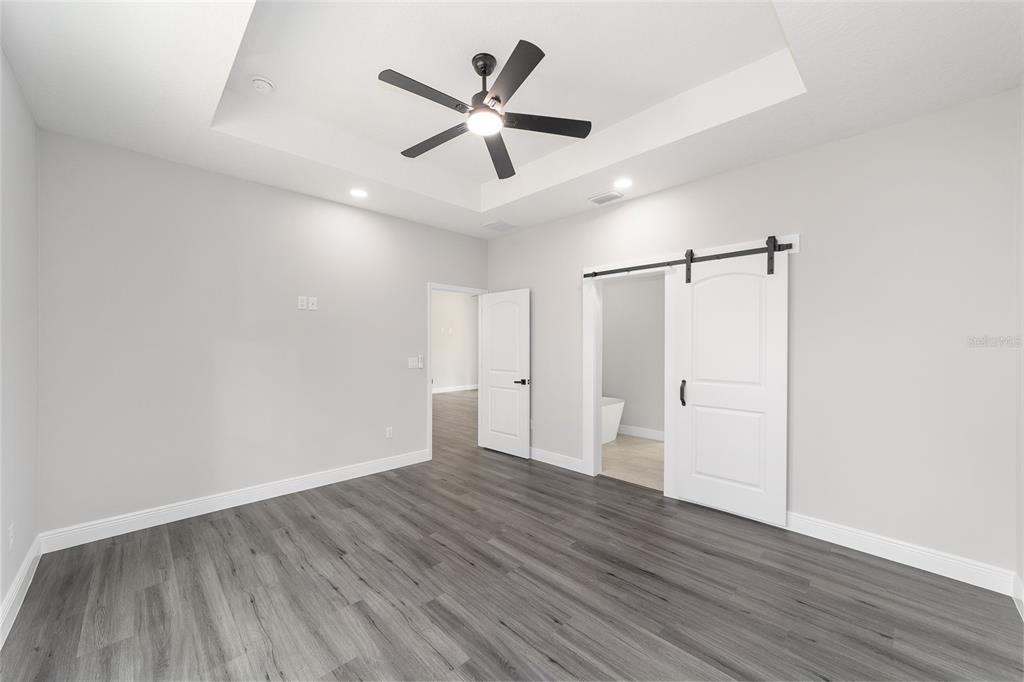 1370 Northeast 151 Avenue Williston, FL 32696 - Photo 22 of 51 a view of a big room with wooden floor and windows