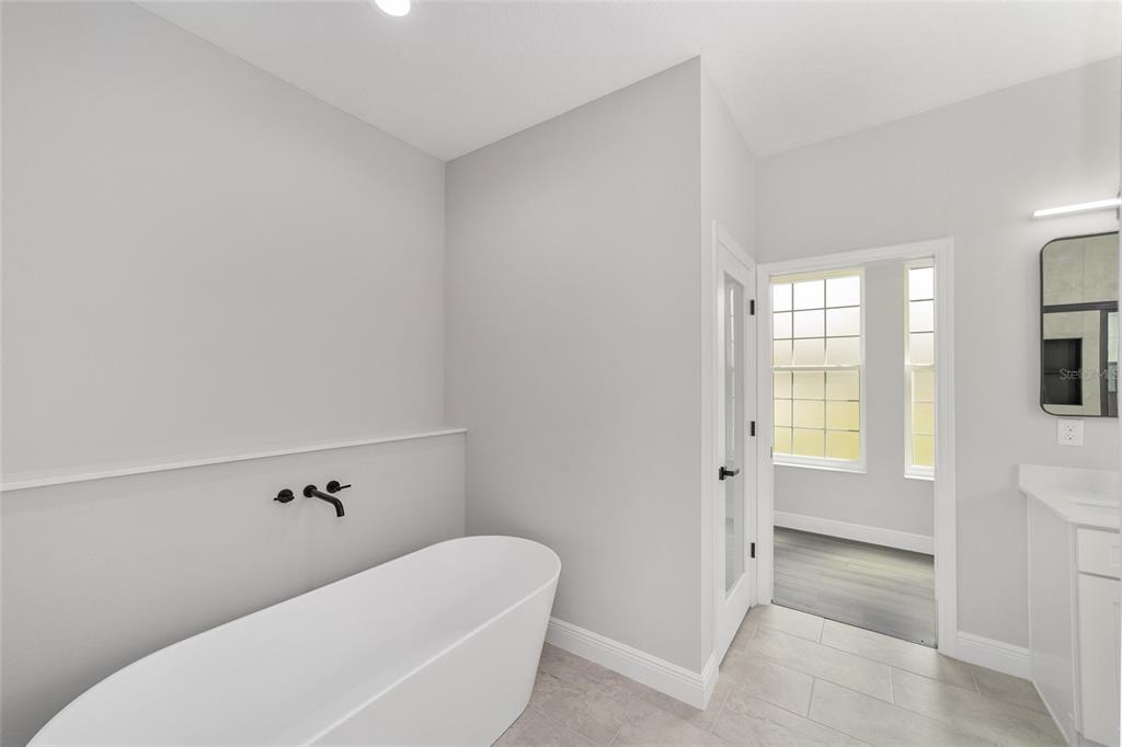 1370 Northeast 151 Avenue Williston, FL 32696 - Photo 23 of 51 a bathroom with a bathtub and a shower