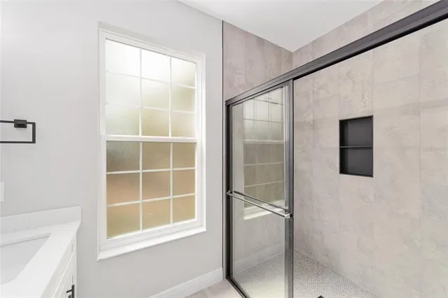 a bathroom with a tub and shower