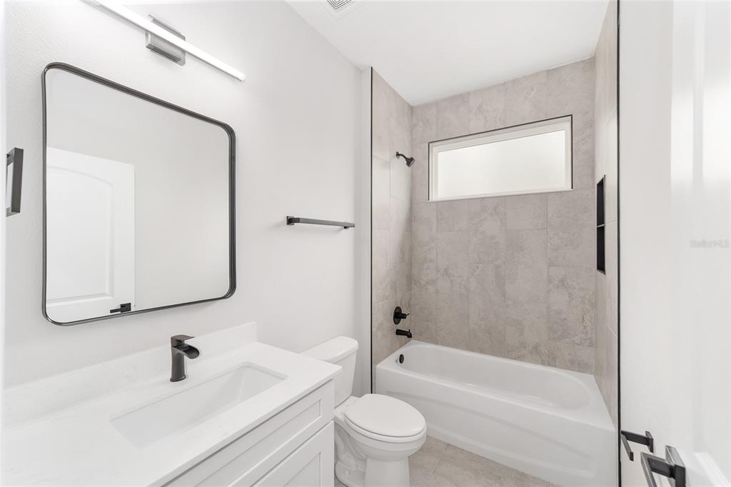 1370 Northeast 151 Avenue Williston, FL 32696 - Photo 30 of 51 a bathroom with a sink a toilet and a mirror