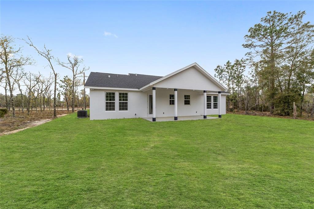 1370 Northeast 151 Avenue Williston, FL 32696 - Photo 3 of 51 a front view of house with yard and green space