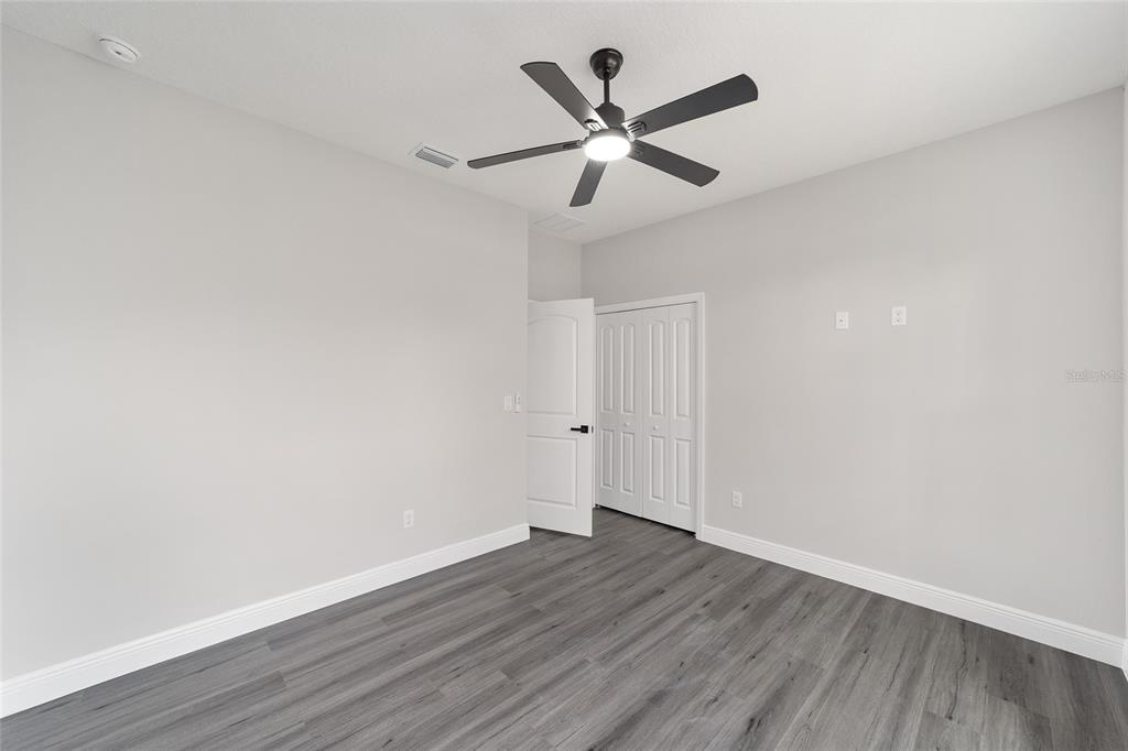 1370 Northeast 151 Avenue Williston, FL 32696 - Photo 32 of 51 a view of a big room with wooden floor and windows