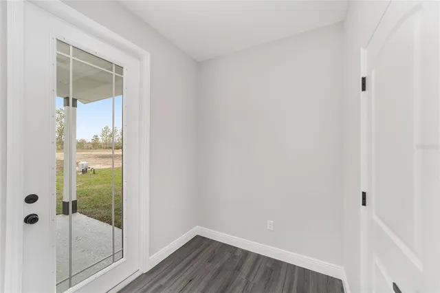 a bathroom with a glass shower door