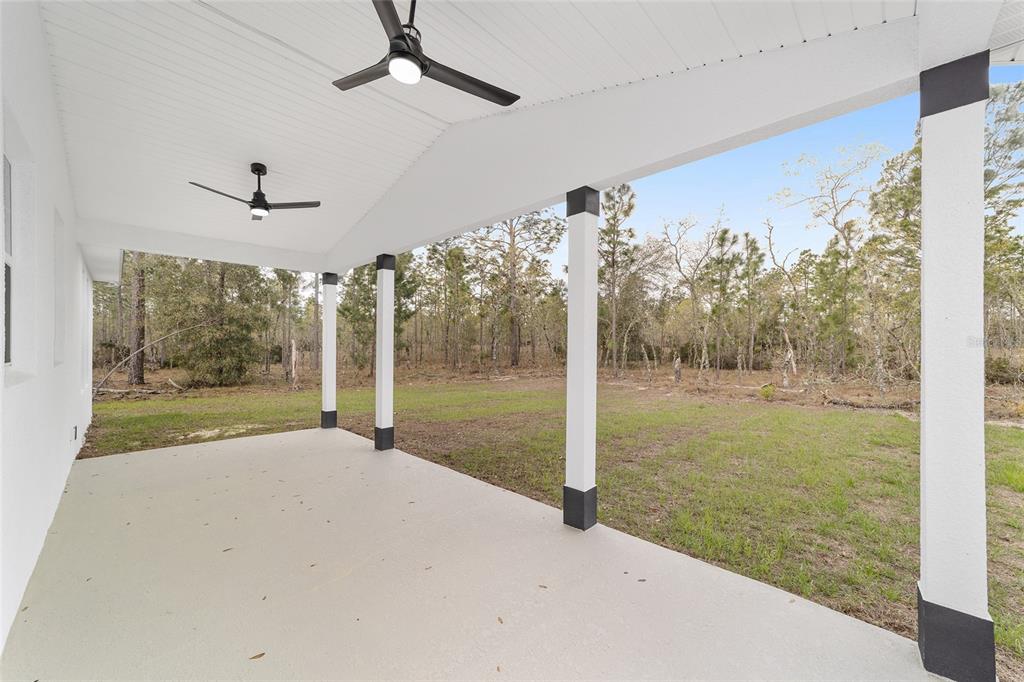 1370 Northeast 151 Avenue Williston, FL 32696 - Photo 35 of 51 a view of a room with window tree and wooden floor