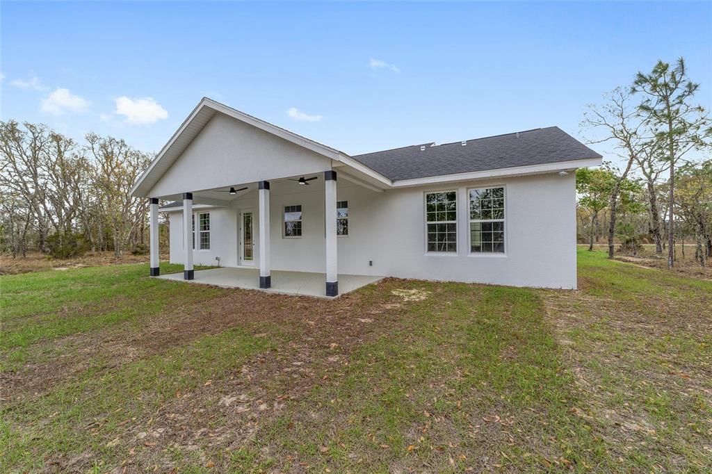 1370 Northeast 151 Avenue Williston, FL 32696 - Photo 37 of 51 a view of a house with a yard