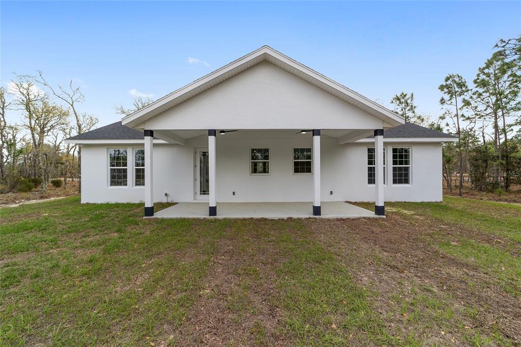 1370 Northeast 151 Avenue Williston, FL 32696 - Photo 38 of 51 a front view of a house with a yard