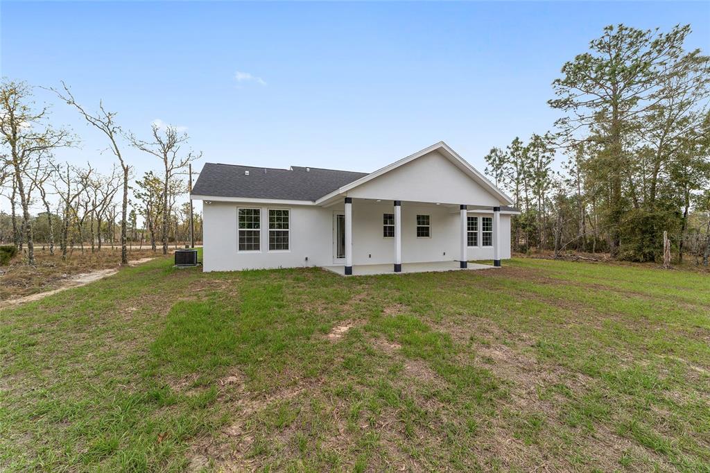 1370 Northeast 151 Avenue Williston, FL 32696 - Photo 39 of 51 a view of a house with a backyard