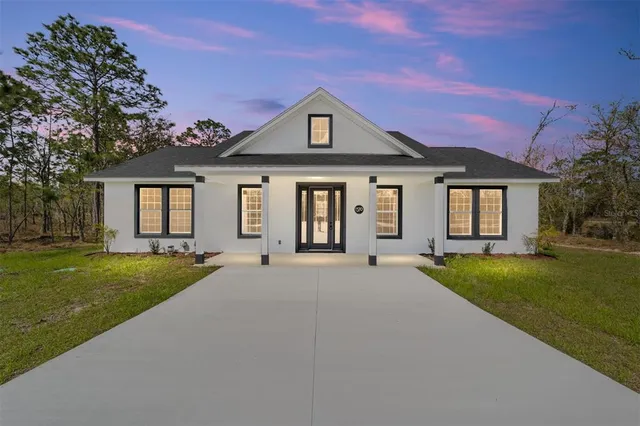 front view of a house with a yard