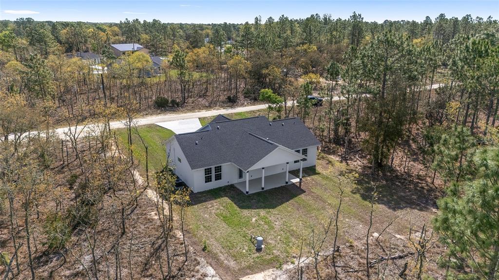 1370 Northeast 151 Avenue Williston, FL 32696 - Photo 47 of 51 a view of a house with a yard