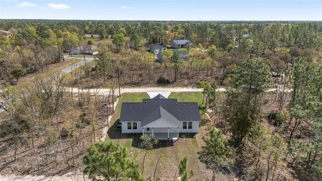 an aerial view of residential house with parking space