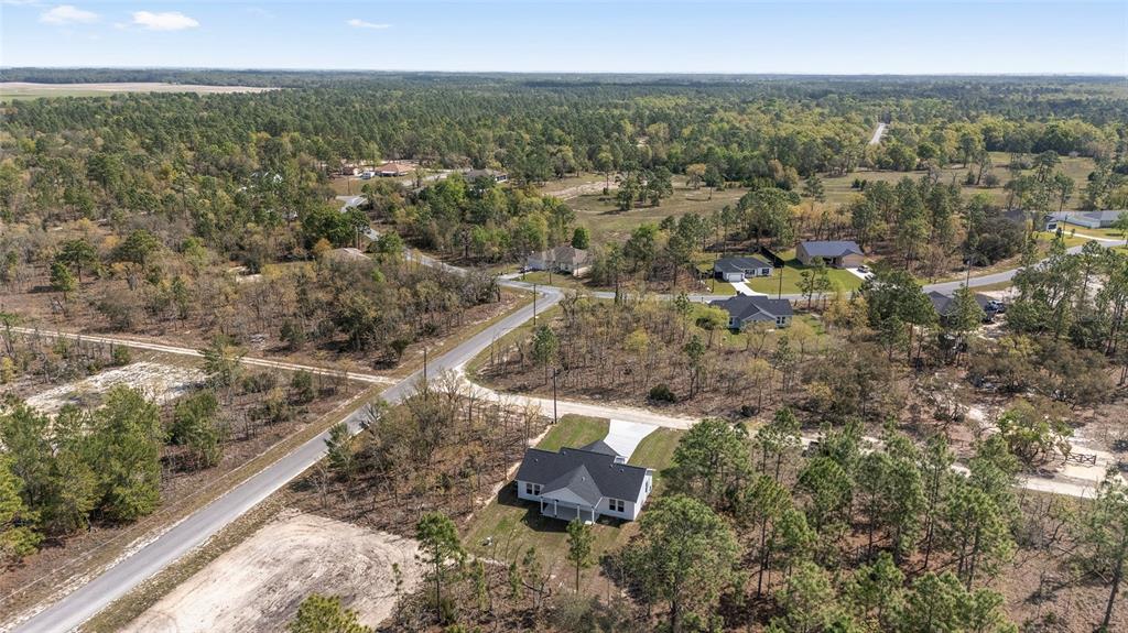 1370 Northeast 151 Avenue Williston, FL 32696 - Photo 49 of 51 an aerial view of residential house with parking space