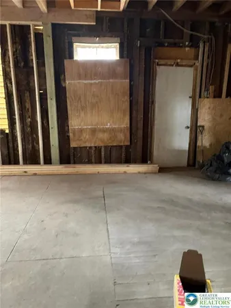 a view of an empty room with wooden walls
