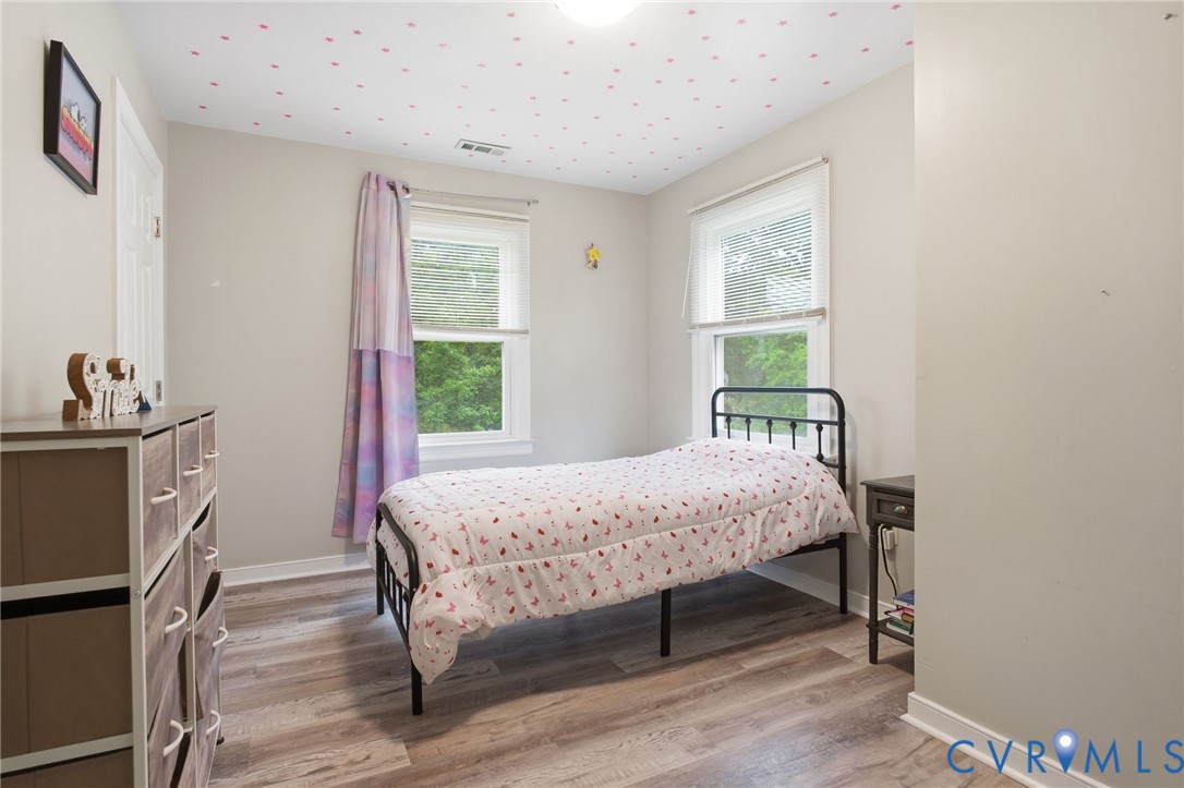 9110 Gayton Road Henrico, VA 23229 - Photo 32 of 54 a bedroom with a bed and a window