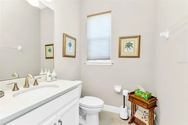 a bedroom with furniture and a flat screen tv