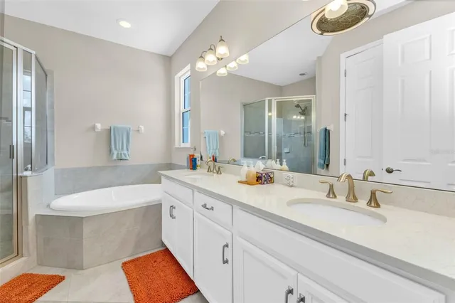 a bedroom with a bed and a television