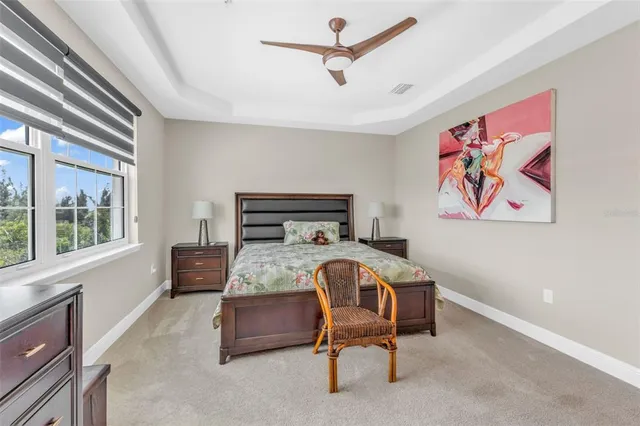 a bedroom with a bed and a tv