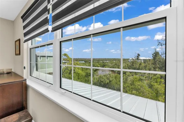 a view of room with wooden floor and white walls