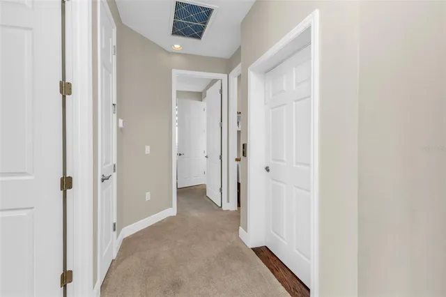 a bedroom with a bed and a ceiling fan