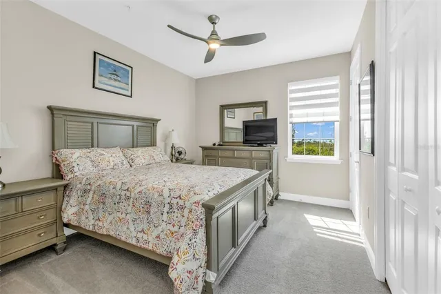 a bedroom with a bed and a television