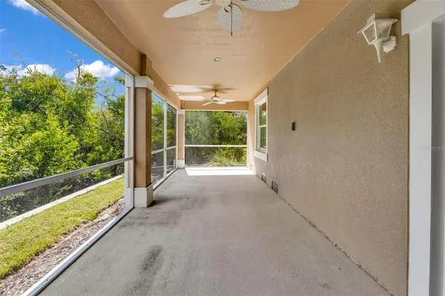 an aerial view of a house with a table and chairs