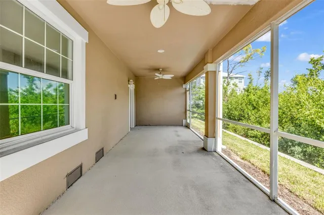 a aerial view of a house with a garden and lake view
