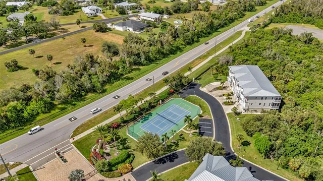 a aerial view of a house with a lake view
