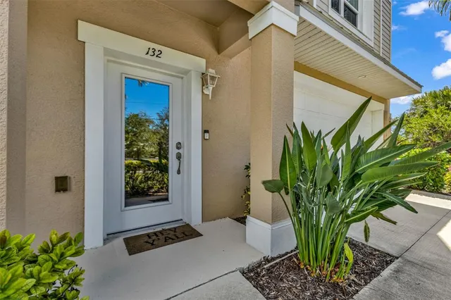 a potted plant in front of a house