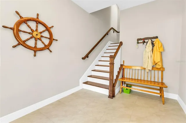 a kitchen with stainless steel appliances granite countertop a refrigerator a oven a sink a stove and a cabinets