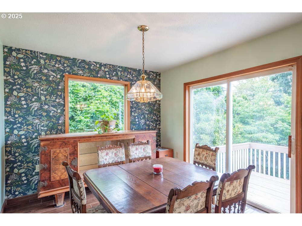 609 Van Buren Street Oregon City, OR 97045 - Photo 11 of 34 a view of a dining room with furniture window and outside view