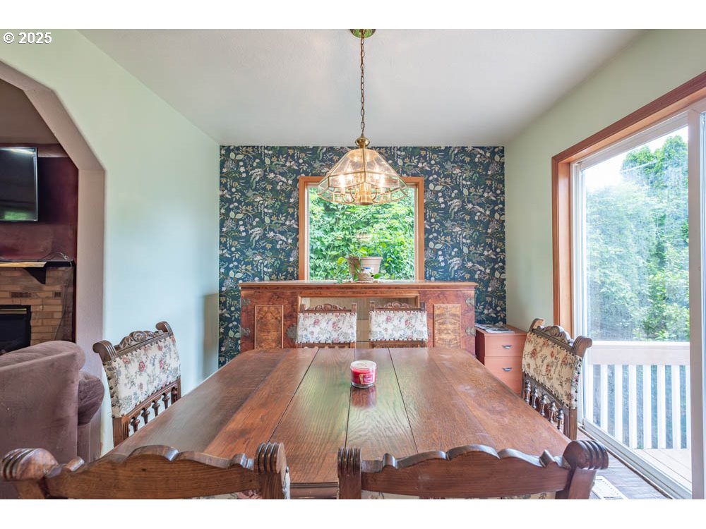 609 Van Buren Street Oregon City, OR 97045 - Photo 12 of 34 a living room with furniture and a chandelier