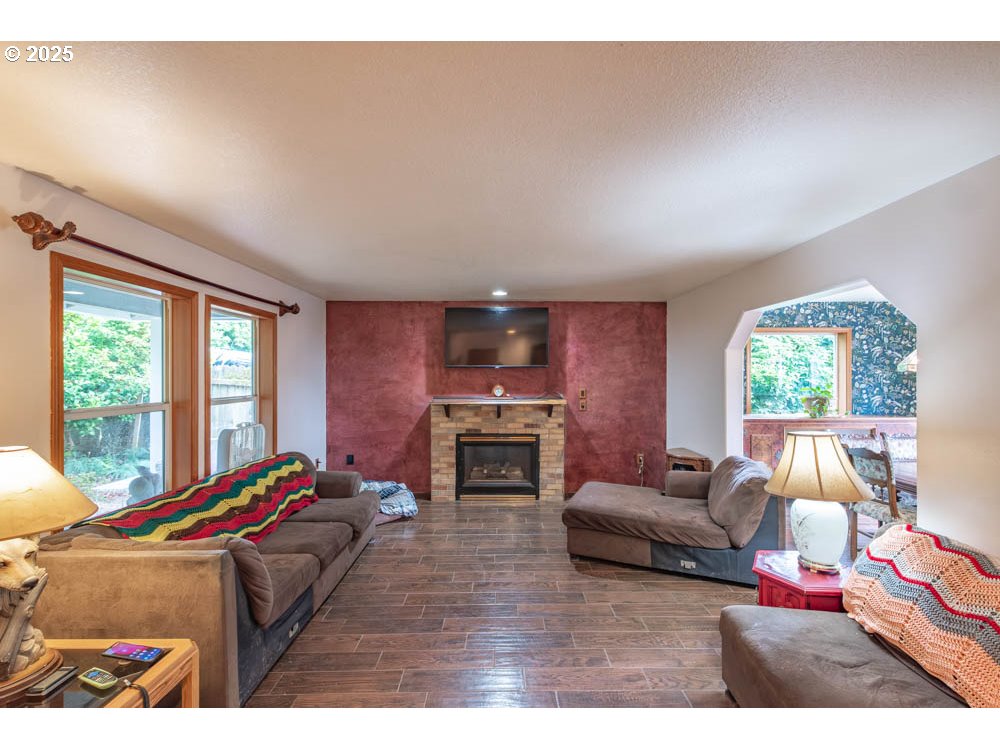 609 Van Buren Street Oregon City, OR 97045 - Photo 15 of 34 a living room with furniture fireplace and flat screen tv