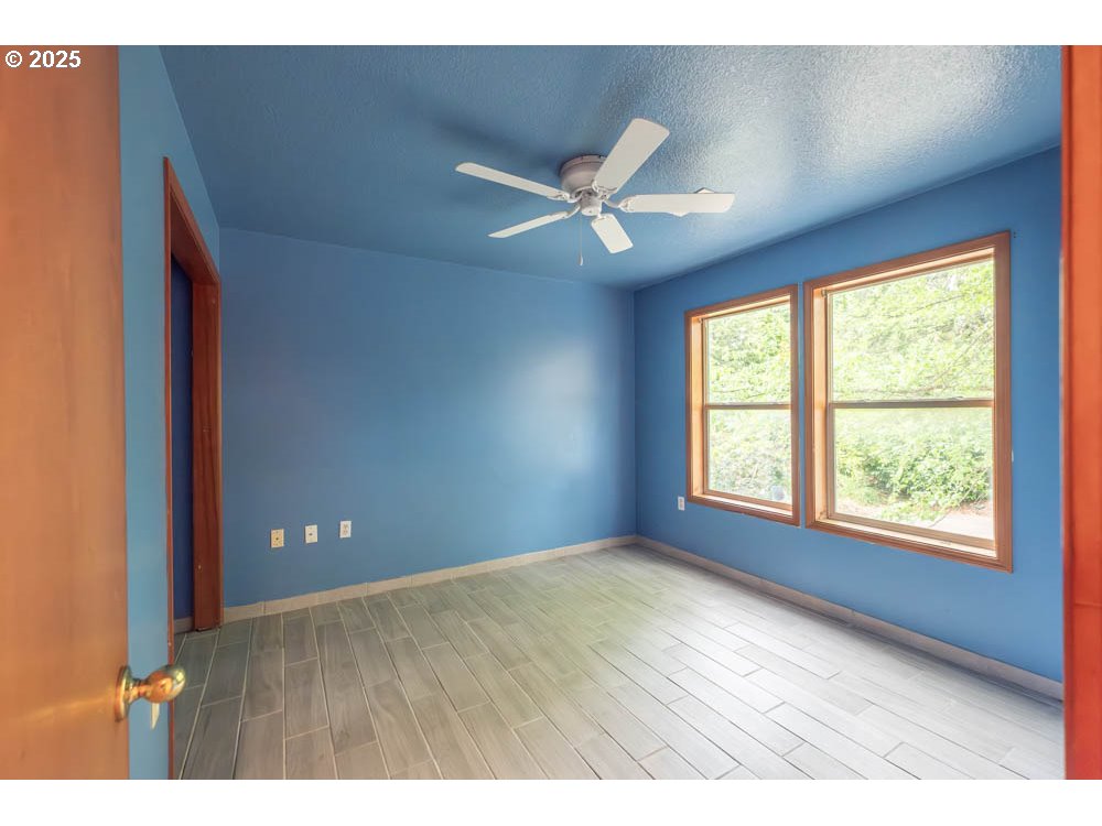 609 Van Buren Street Oregon City, OR 97045 - Photo 22 of 34 a view of an empty room with a window