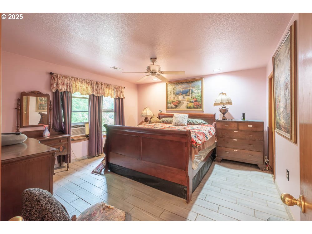 609 Van Buren Street Oregon City, OR 97045 - Photo 25 of 34 a living room with furniture and a wooden floor
