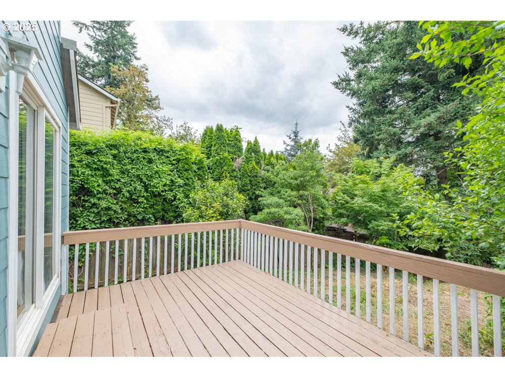 609 Van Buren Street Oregon City, OR 97045 - Photo 30 of 34 a balcony with wooden floor and fence