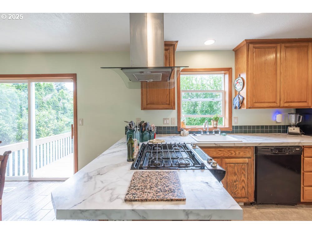 609 Van Buren Street Oregon City, OR 97045 - Photo 3 of 34 a kitchen with a large window appliances and cabinets