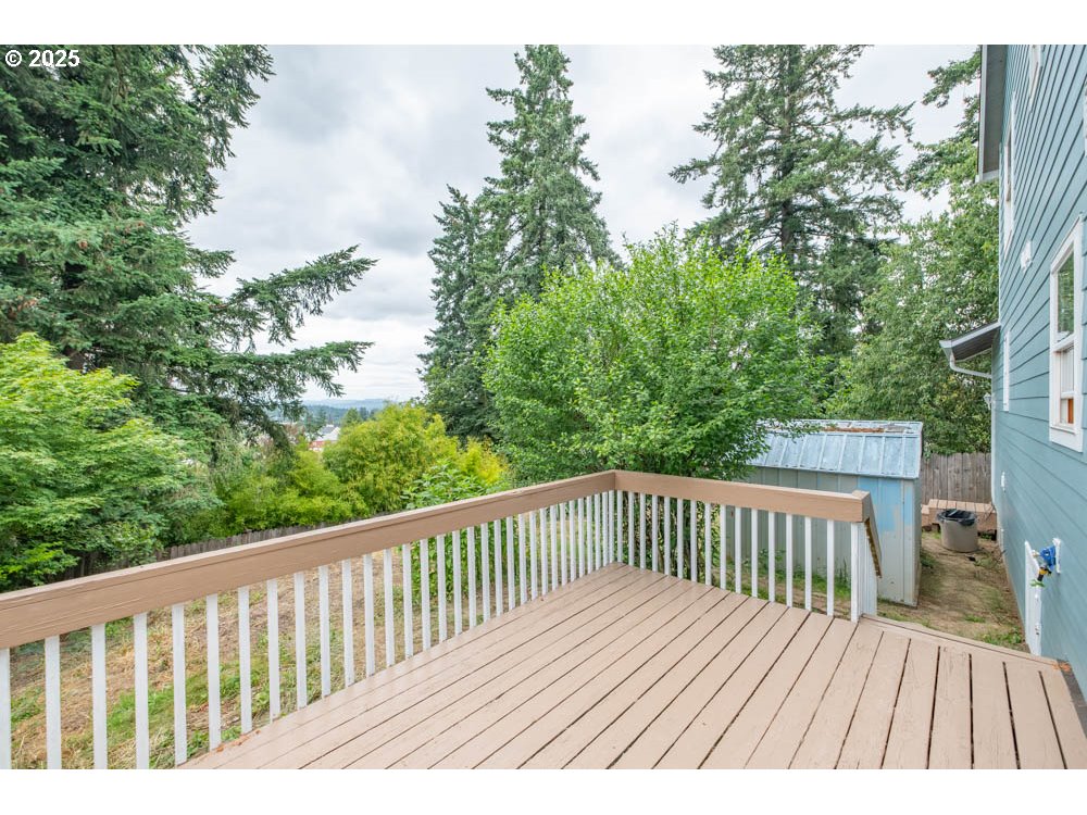 609 Van Buren Street Oregon City, OR 97045 - Photo 31 of 34 a view of balcony with wooden floor and fence