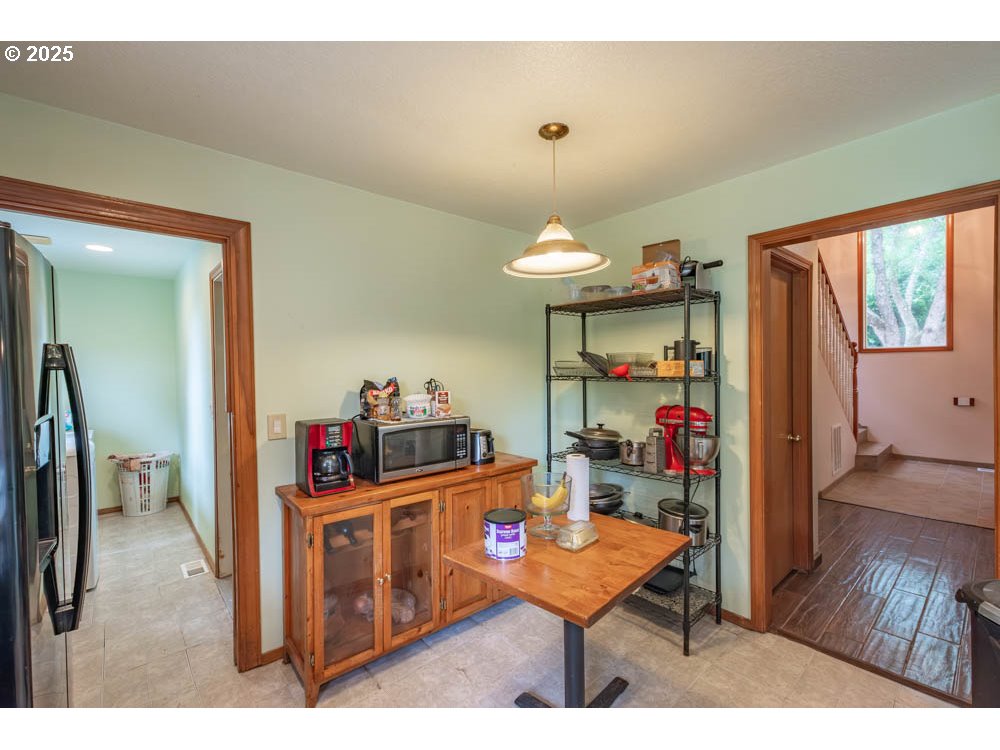 609 Van Buren Street Oregon City, OR 97045 - Photo 9 of 34 a room with furniture and a wooden floor