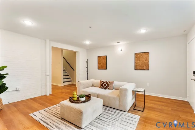 a bedroom with a balcony a bed and a flat screen tv