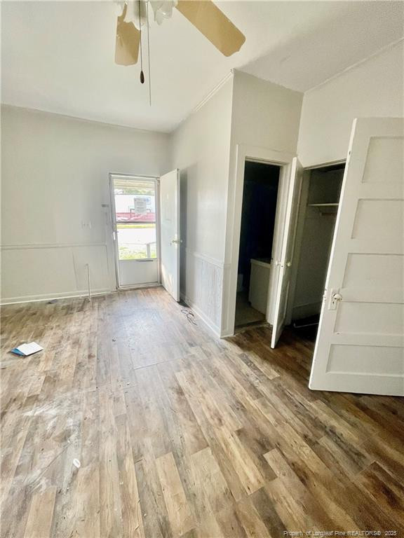 401 South Clinton Avenue, Unit B Dunn, NC 28334 - Photo 2 of 8 a view of empty room with wooden floor