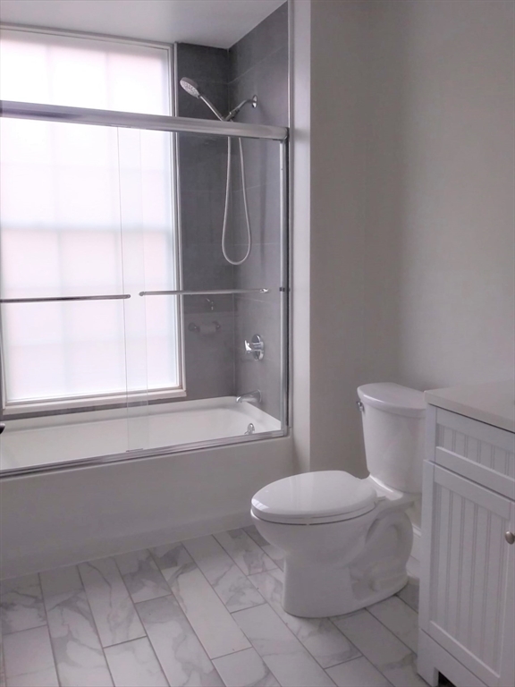 45 Summer Street, Unit 109 Leominster, MA 01453 - Photo 3 of 7 a bathroom with a toilet and a shower