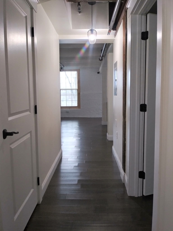 45 Summer Street, Unit 109 Leominster, MA 01453 - Photo 4 of 7 a view of a hallway with wooden floor