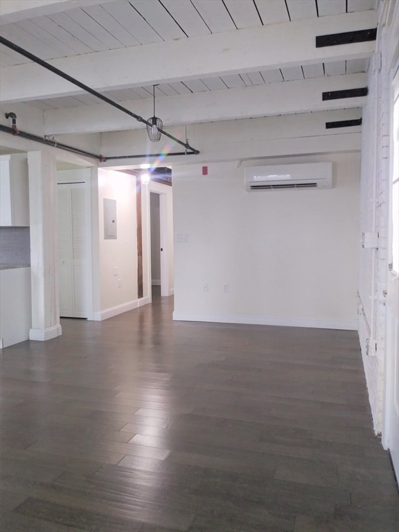 45 Summer Street, Unit 109 Leominster, MA 01453 - Photo 6 of 7 a view of a room with wooden floor