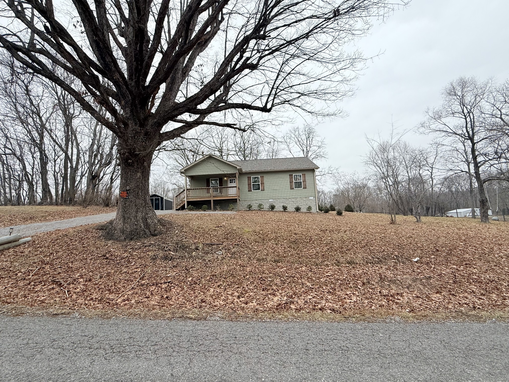 695 Hog Back Ridge Road Bethpage, TN 37022 - Photo 16 of 19 a front view of house with a trees