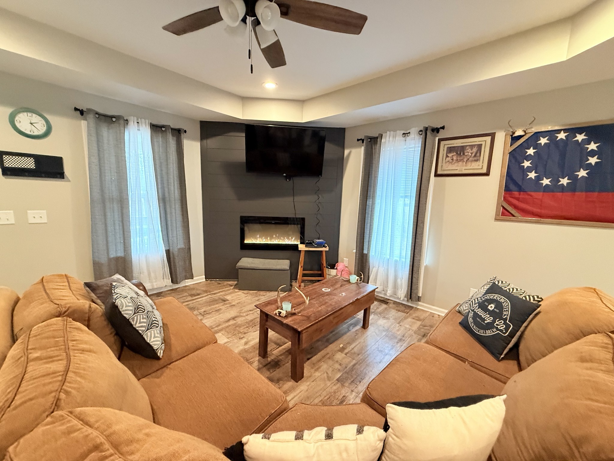 695 Hog Back Ridge Road Bethpage, TN 37022 - Photo 3 of 19 a bedroom with a bed couch and a fireplace