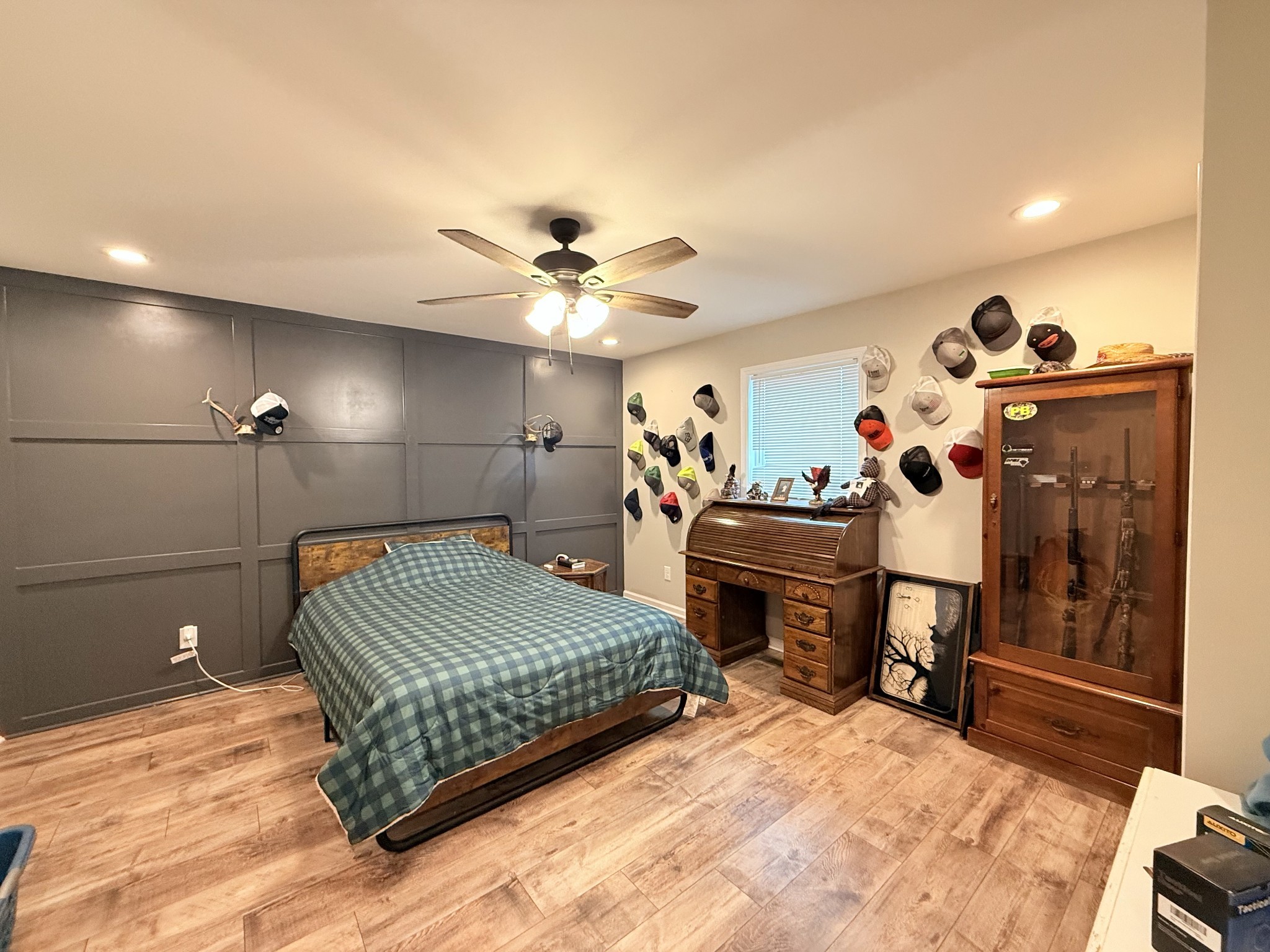 695 Hog Back Ridge Road Bethpage, TN 37022 - Photo 5 of 19 a bedroom with a bed and a chandelier