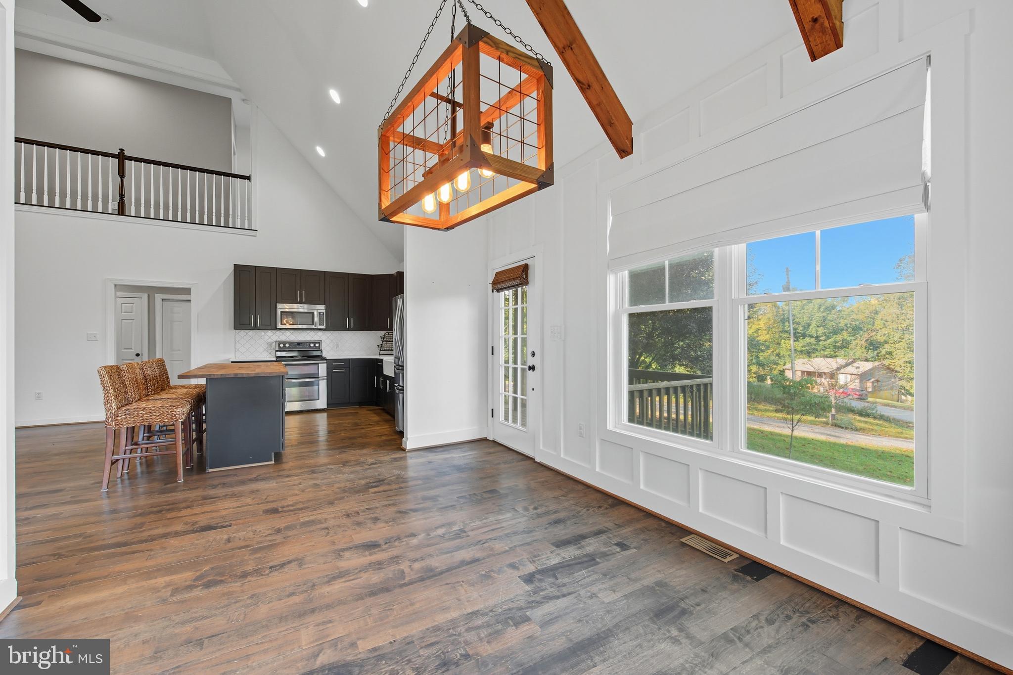 540 Mcdonalds Farm Road Linden, VA 22642 - Photo 12 of 60 a living room with furniture a fireplace and wooden floor