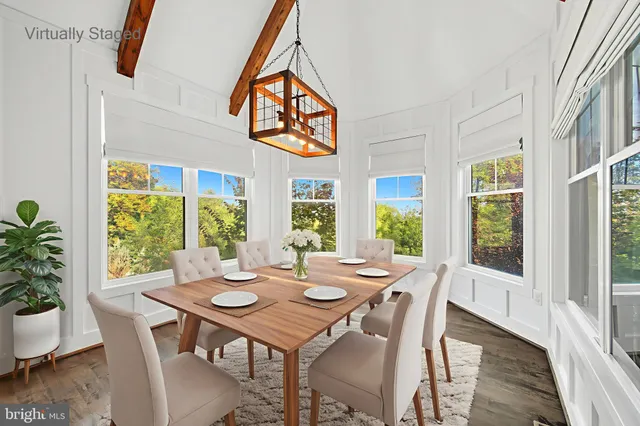 a kitchen with stainless steel appliances granite countertop a stove top oven a sink dishwasher and a refrigerator with wooden floor