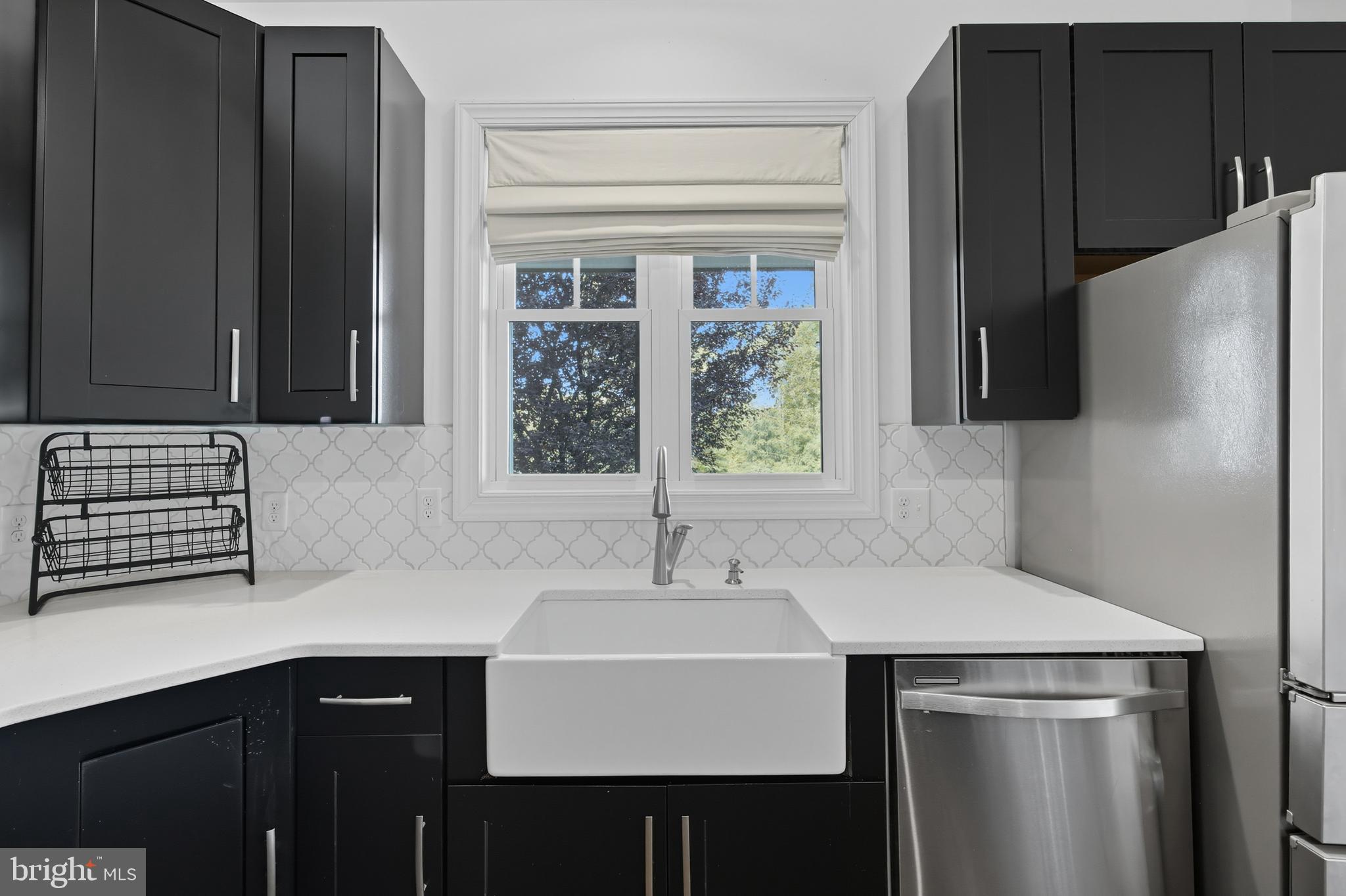 540 Mcdonalds Farm Road Linden, VA 22642 - Photo 20 of 60 a kitchen with a sink a refrigerator and window