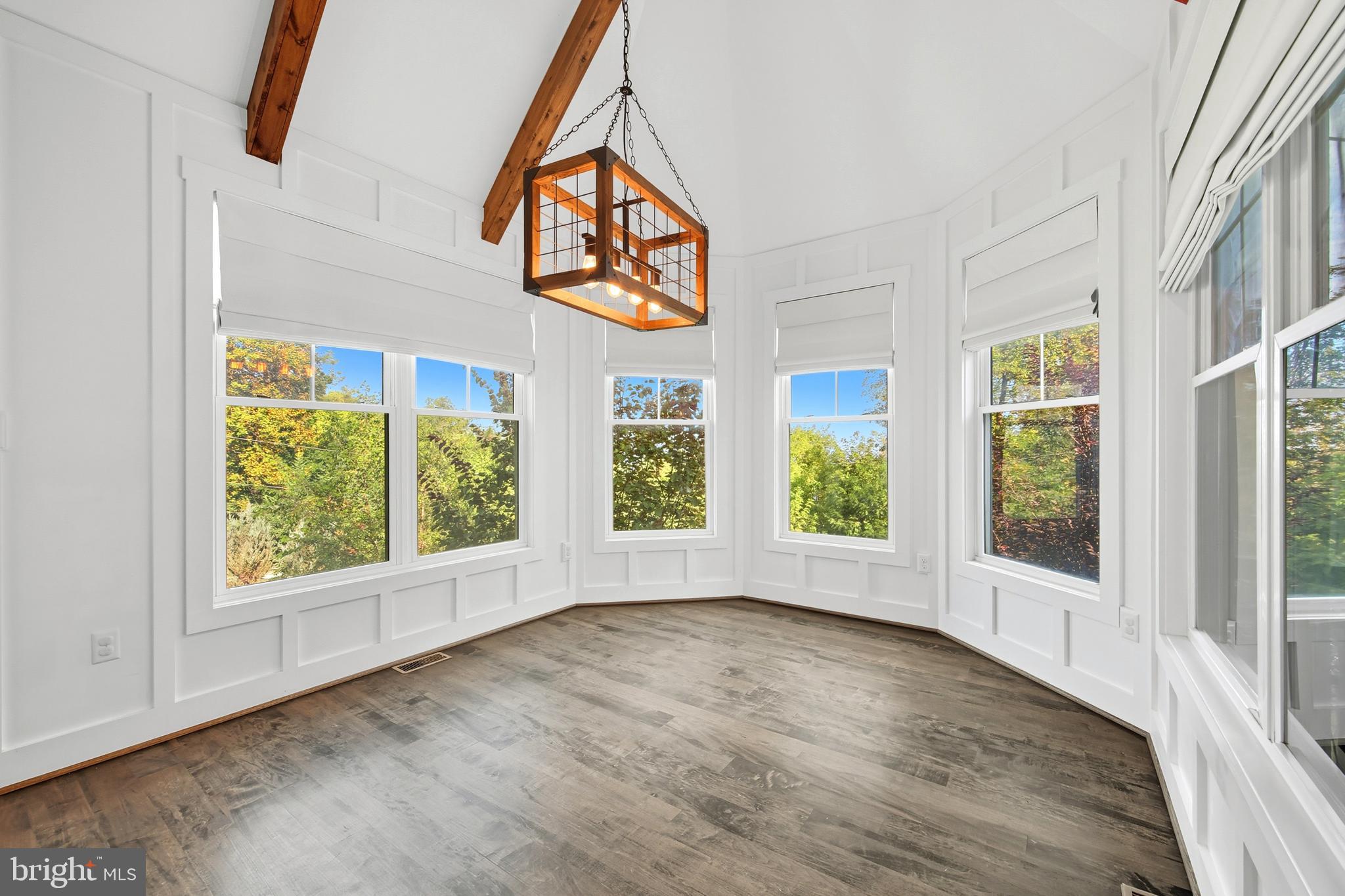 540 Mcdonalds Farm Road Linden, VA 22642 - Photo 21 of 60 an empty room with wooden floor and windows