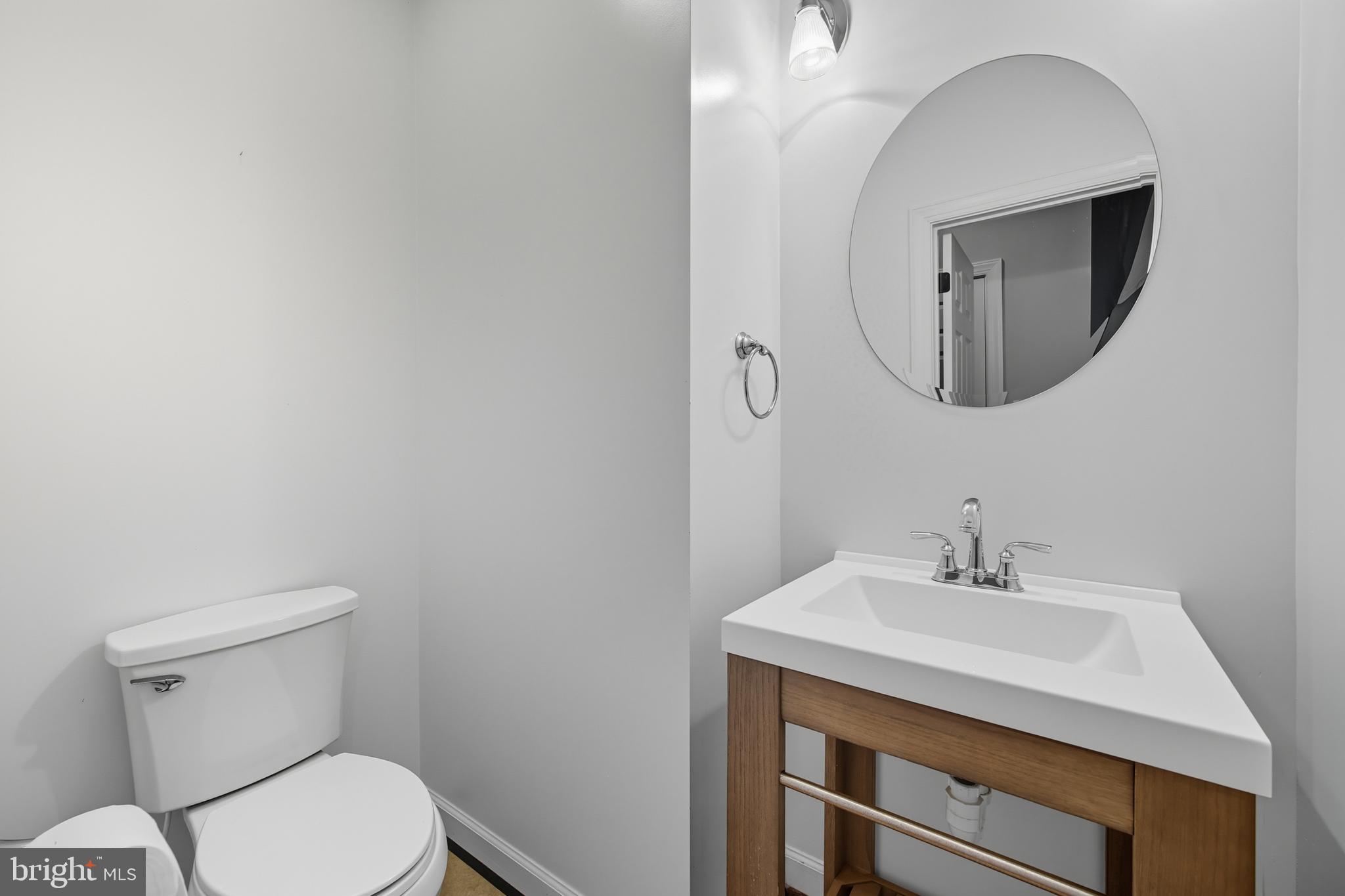 540 Mcdonalds Farm Road Linden, VA 22642 - Photo 25 of 60 a bathroom with a toilet a sink and mirror